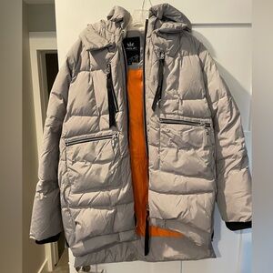 Grey sleeping bag utility jacket, with adjustable sizing with zipper sides